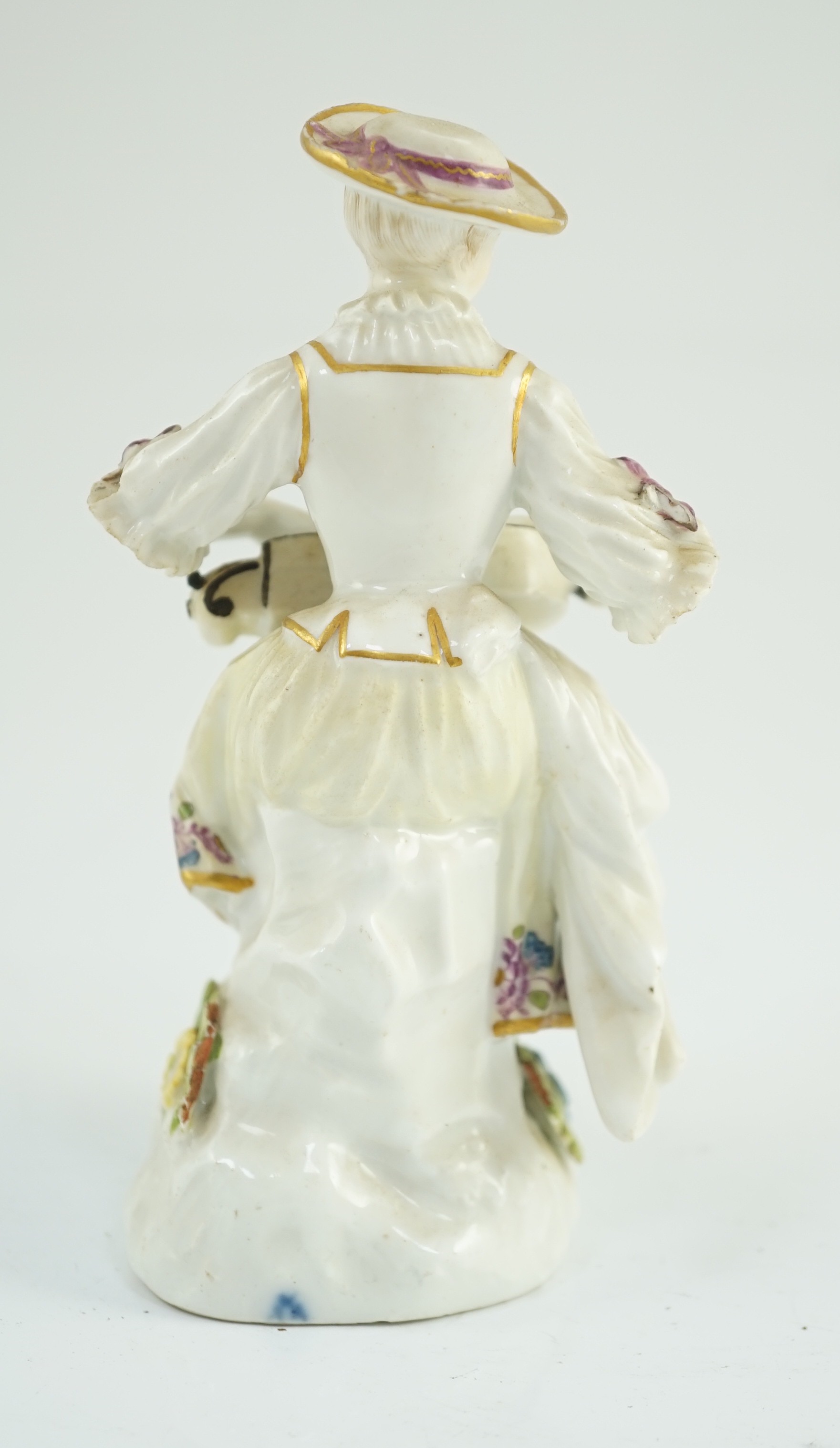 A Meissen porcelain figure of a woman playing the hurdy gurdy, mid 18th century, possibly modelled by J. J. Kandler, 13cm high, restored right foot, Provenance - purchased from Winifred Williams, Eastbourne/London before